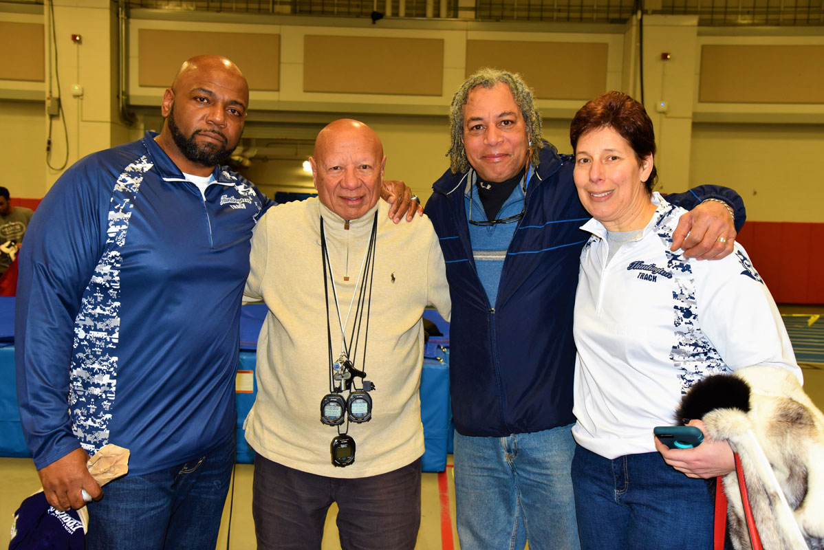 Huntington boys' track coaches and consultants were a happy bunch after winning the county title 