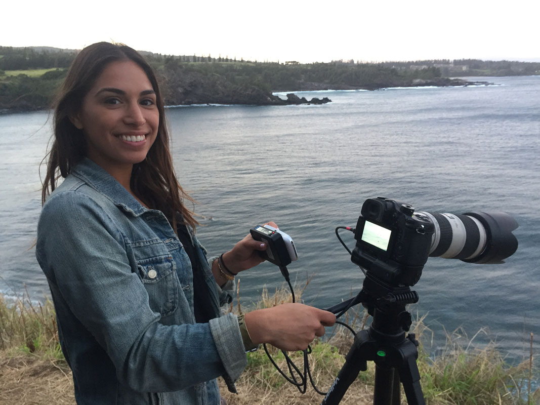 Maya Bengston filming a Facebook live surf session in Maui.