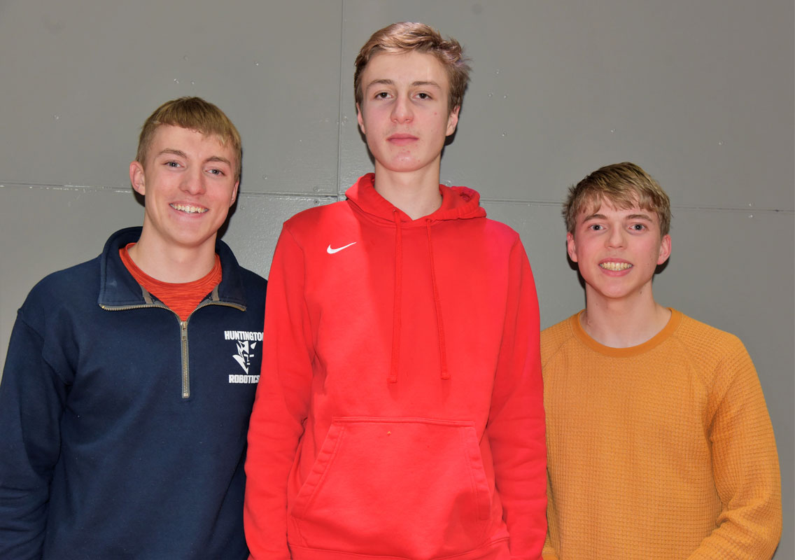 Huntington spelling bee champion Andreas Seferian is flanked by runners-up Jack and Luke Farrell