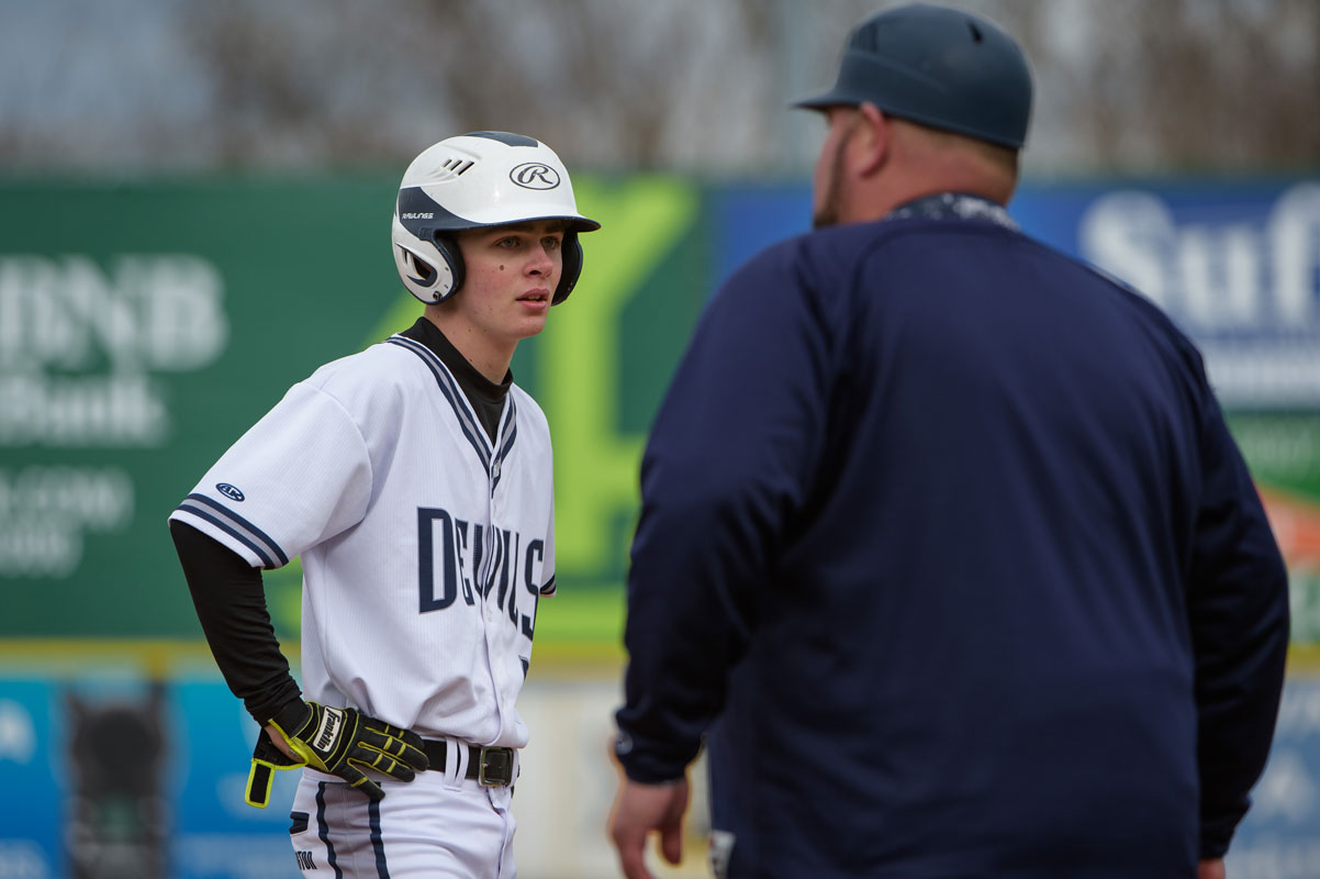 Aidan Bender takes directions from head coach Billy Harris. (Darin Reed photo.)