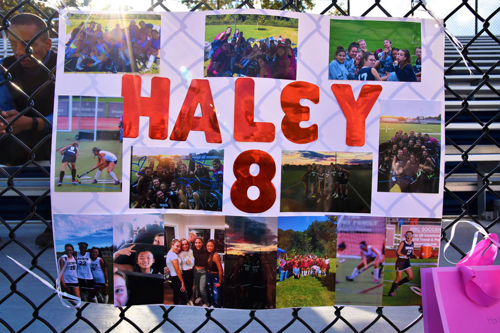 A poster affixed to the Blue Devil Stadium facade celebrated Haley Mortell's field hockey career.