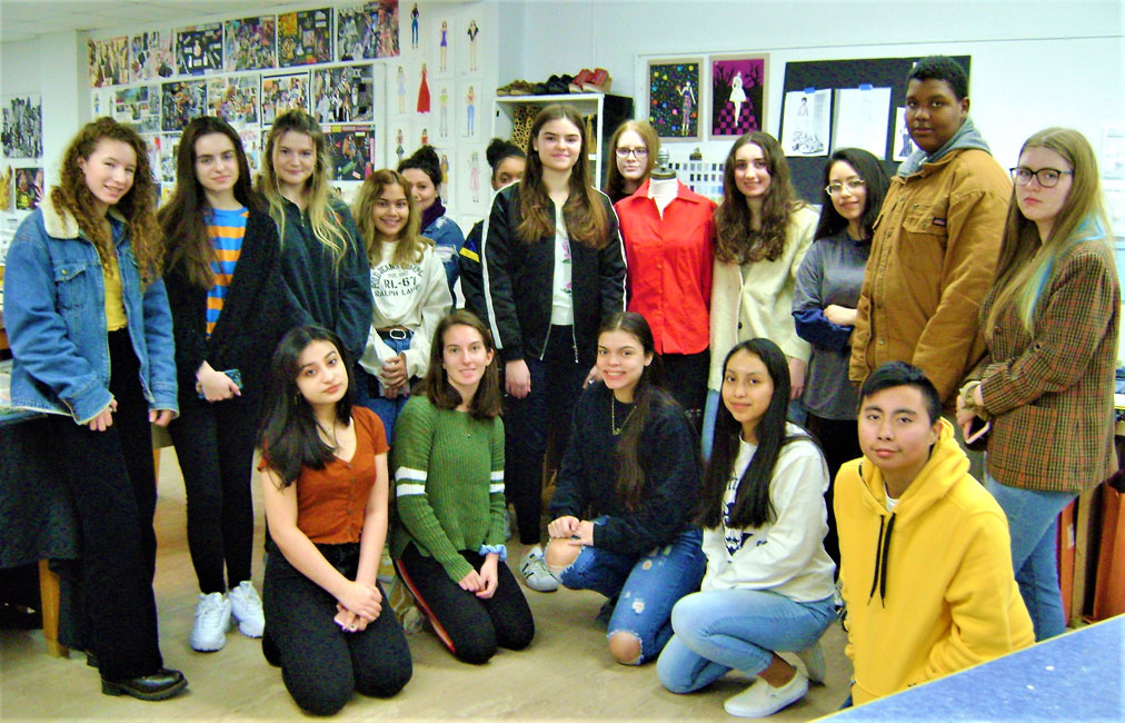 Huntington alum Olivia Hannigan (back row, fourth from right) with high school fashion and design program students.