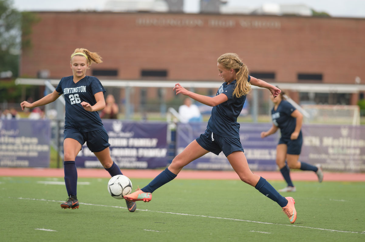 Freshman midfield Katie Browne (right) is one of the Blue Devils' superb athletes. (Darin Reed photo.)