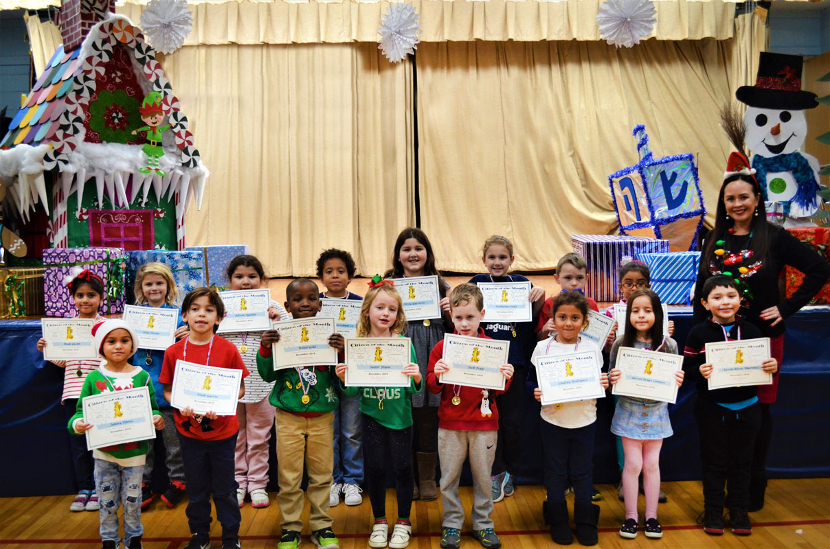 Principal Valerie Capitulo-Saide with December's top Jefferson students.