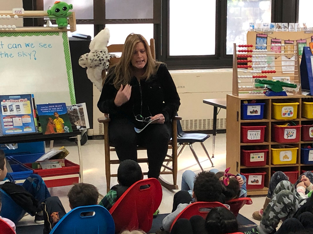 Director of PE & Athletics Georgia D. McCarthy read to students at Southdown School.