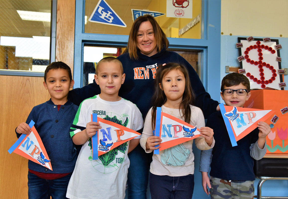 Washington School teacher Margaret Connors with students holding SUNY New Paltz pennants (1)