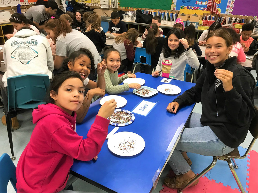 The Interact club members and the Washington School third graders really hit it off with each other.