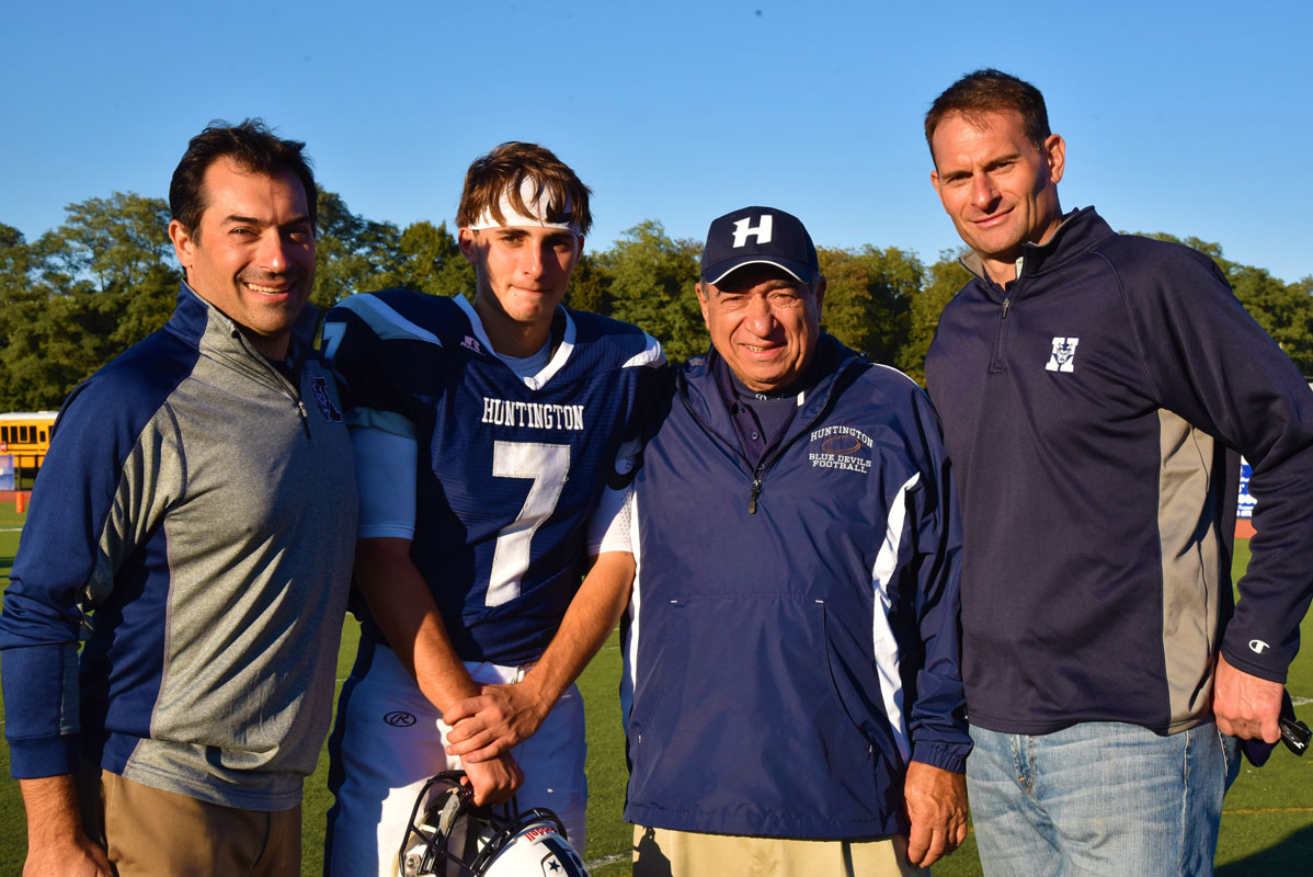 John Paci IV with his uncle, James, grandfather, John Jr. and father, John Paci III at Blue Devil Stadium last fall.