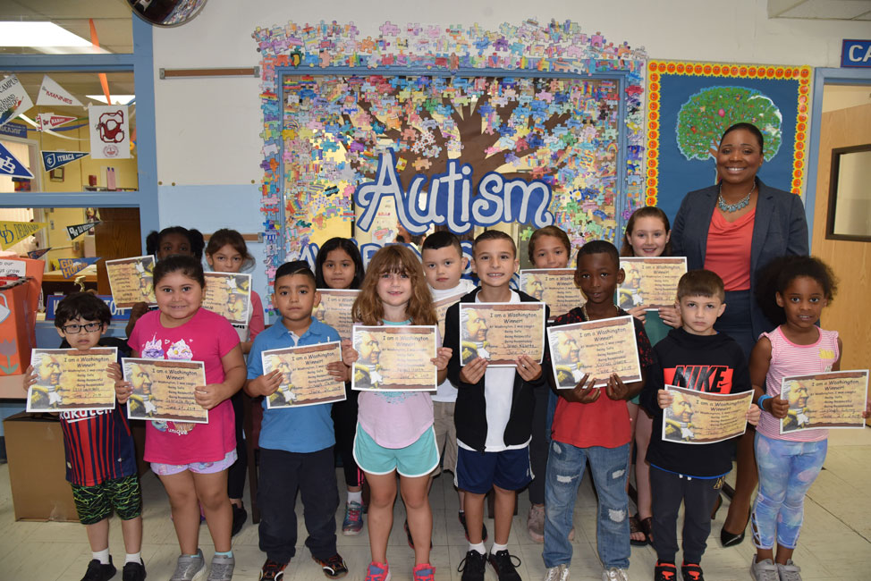 Principal Michelle Richards with June's Washington Ways Award recipients 