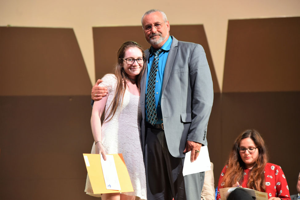Carmen Rivera-Gotay scholars award recipient Casey Smith with high school dean Paul Caleca 