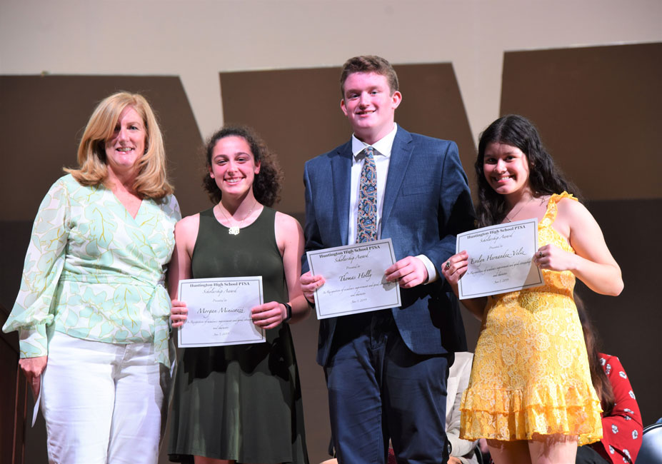 Huntington High School PTSA President Laura Cheshire with scholarship recipients Morgan Minicozzi, Teddy Holly and Evelyn Hernandez-Veliz 