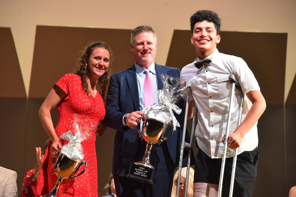 Principal Brenden Cusack with Huntington Alumni Assn. cup recipients Alyssa Sorensen and Danny Arias 