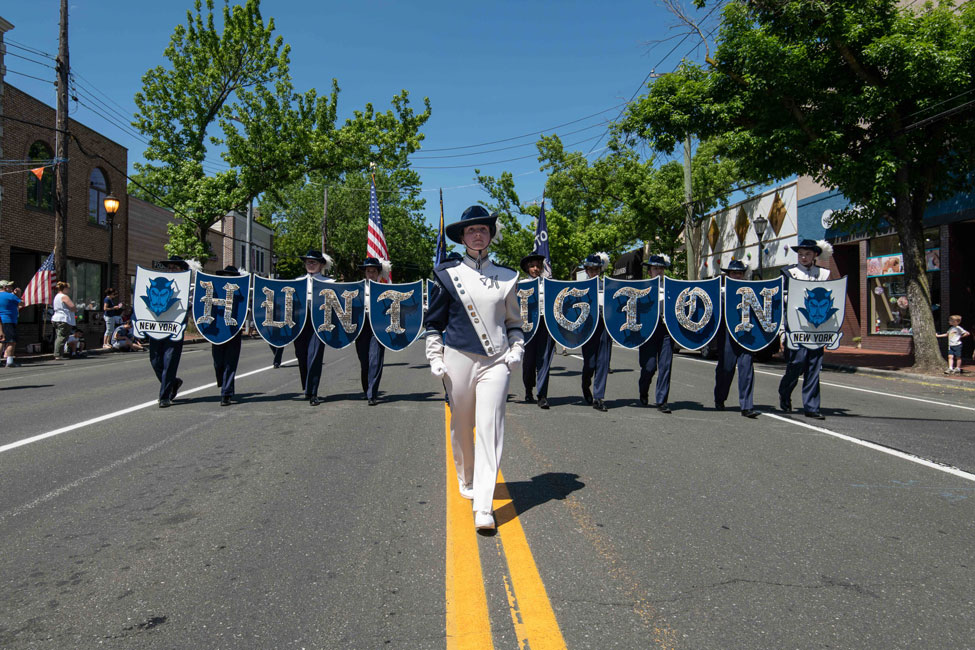The Blue Devil marching band parades down Main Street on Memorial Day last May. (Darin Reed photo.)