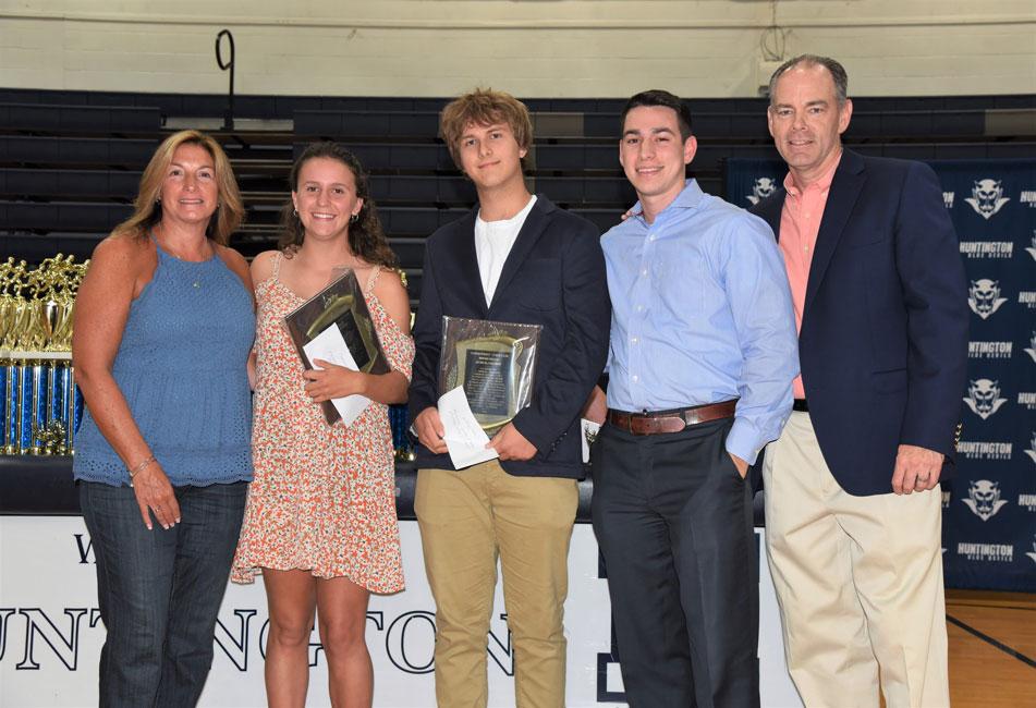 Courney O'Bryan's family with 2019 $1,000 scholarship recipients Alyssa Sorensen and Connor Dougal.