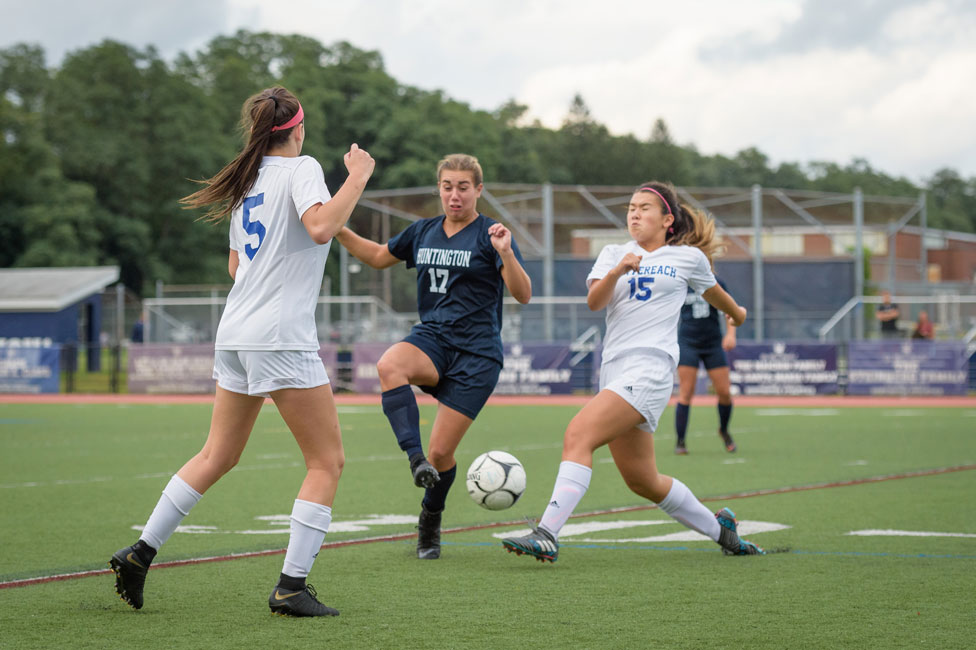 Marissa Stafford (center) is one of the Blue Devil soccer team's stars. (Darin Reed photo.)