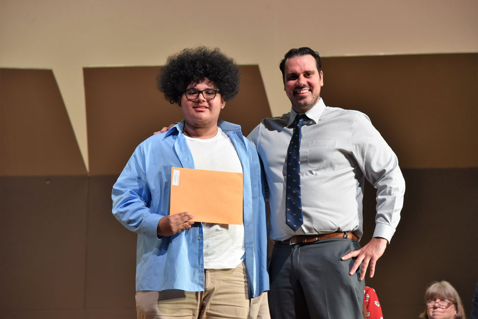 Joseph Toles Scholarship recipient with Huntington Class of 2019 member Oscar Bonilla and counselor Steven Pereira.