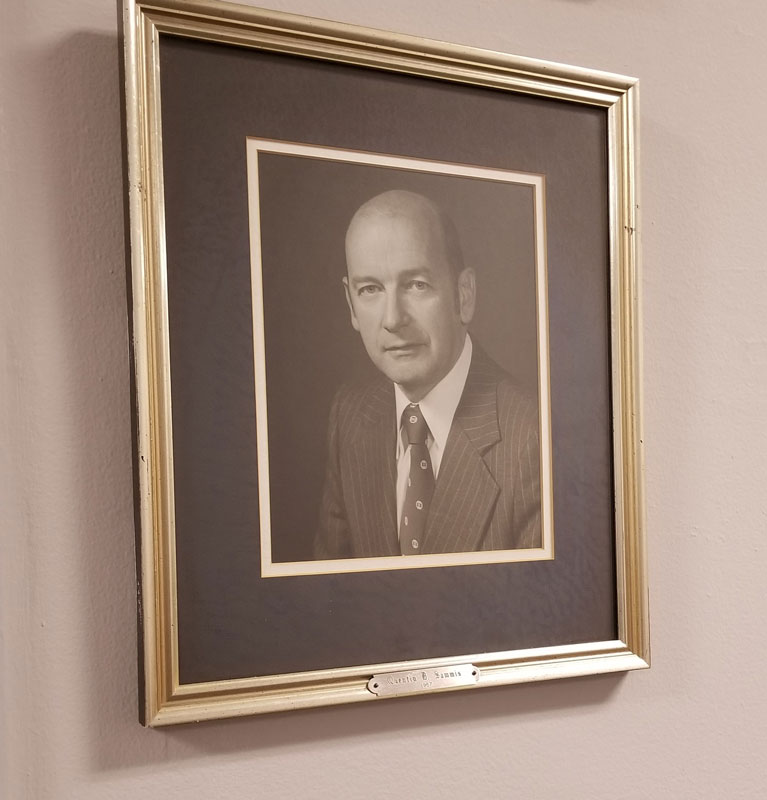 A portrait of Quentin Sammis hangs at Huntington Town Hall.