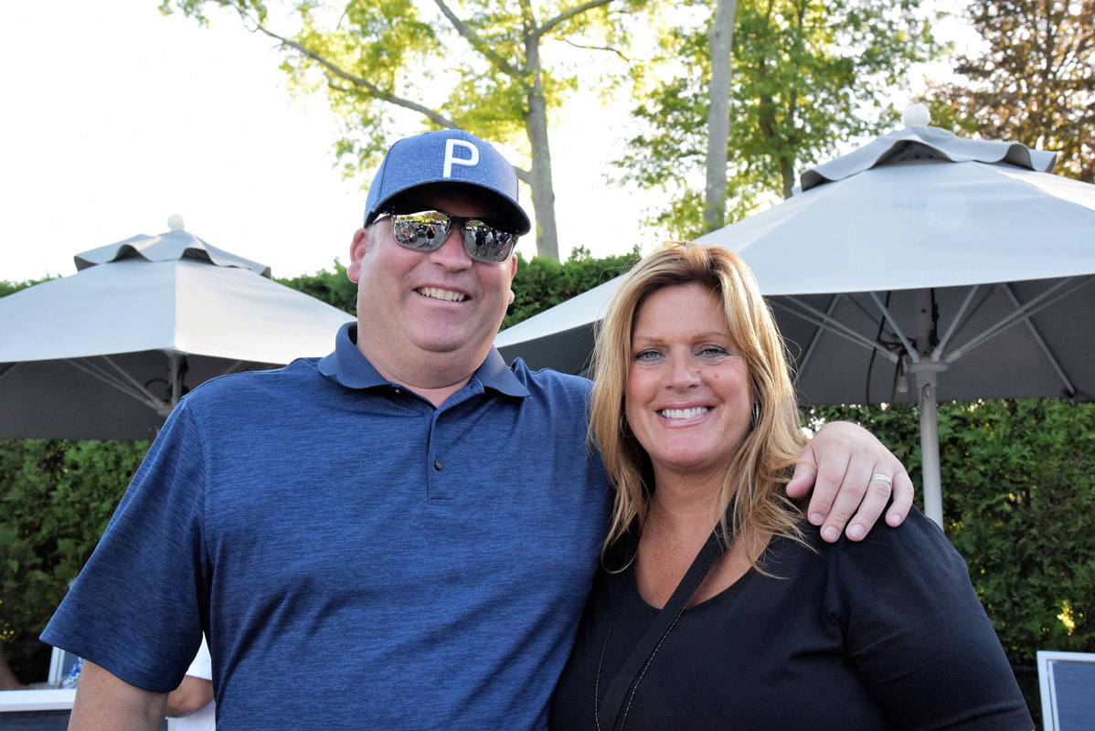 Huntington alum Brad Reminick with Director of Athletics Georgia McCarthy at last year's golf outing.