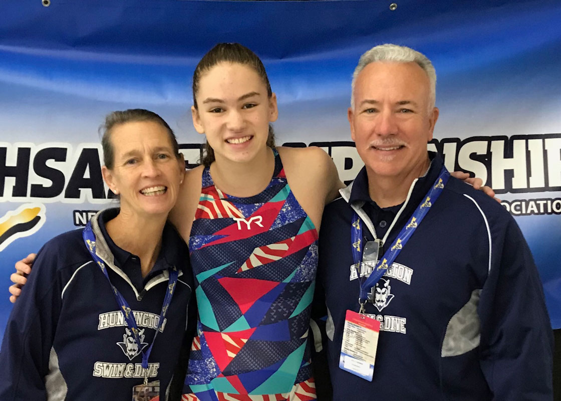 All-State Huntington swimmer Kathryn Montefusco with coaches Meg McConnell and Christopher Helmke.