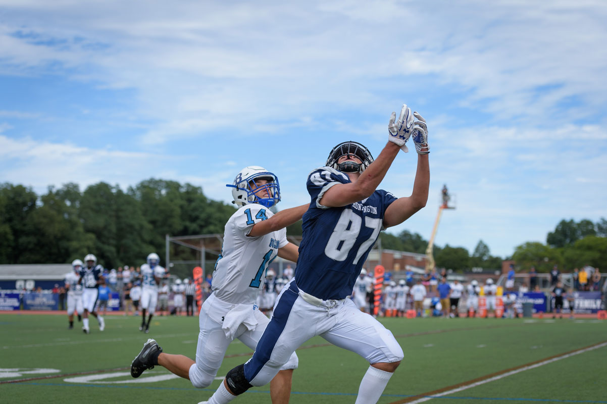 Jon Koumas tracks the pass under tight defensive coverage. (Darin Reed photo.)
