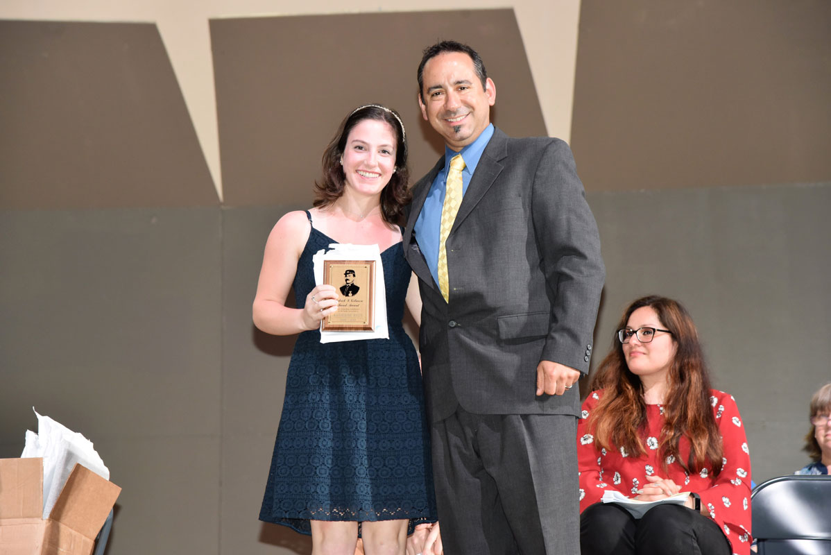 Quinnipiac University bound Katie Riley was presented with the Patrick Gilmore Award by teacher Jason Giachetti.
