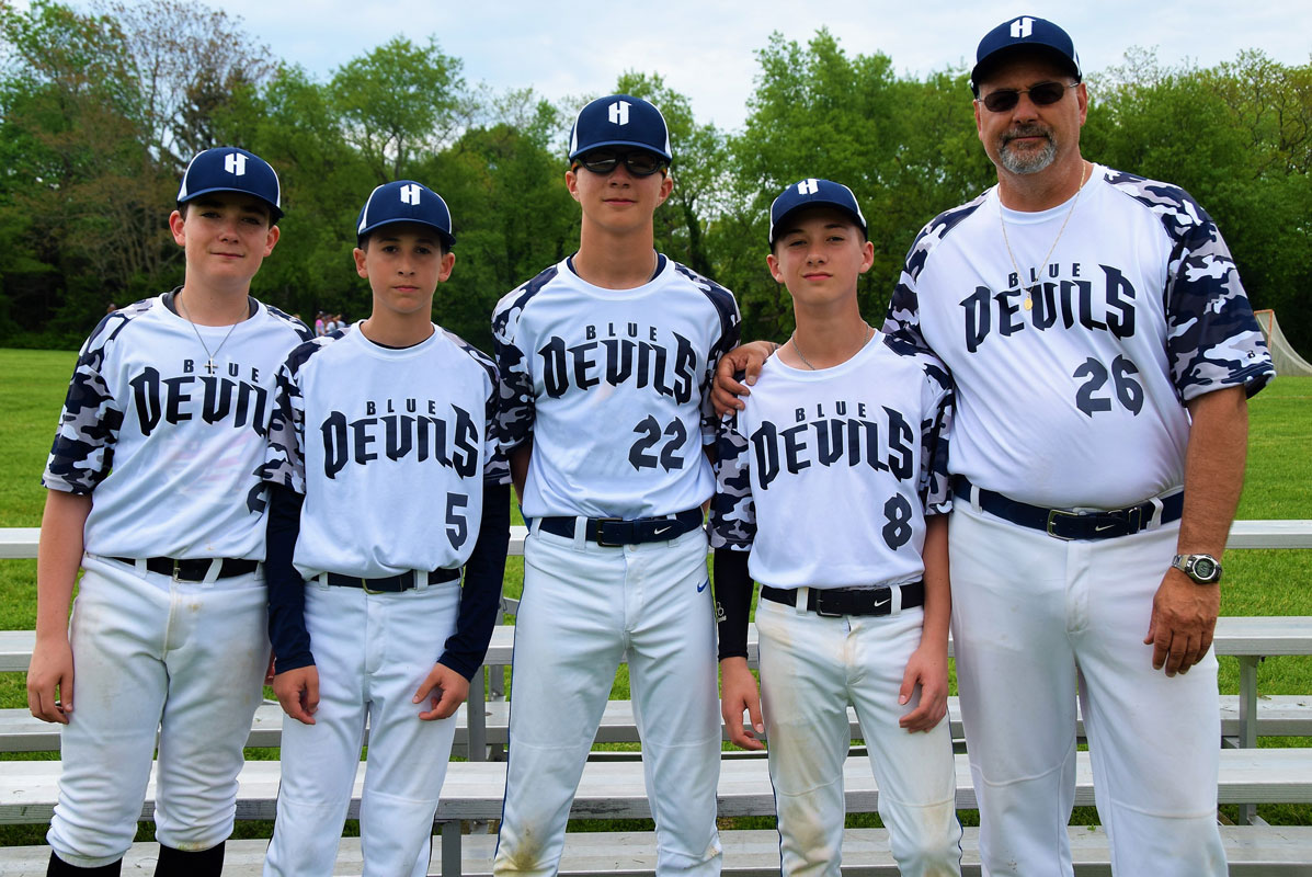 Finley baseball captains Michael Mugno, Matthew Gerardi, Joseph Toscano and Gavin Kata with Coach Paul Caleca 
