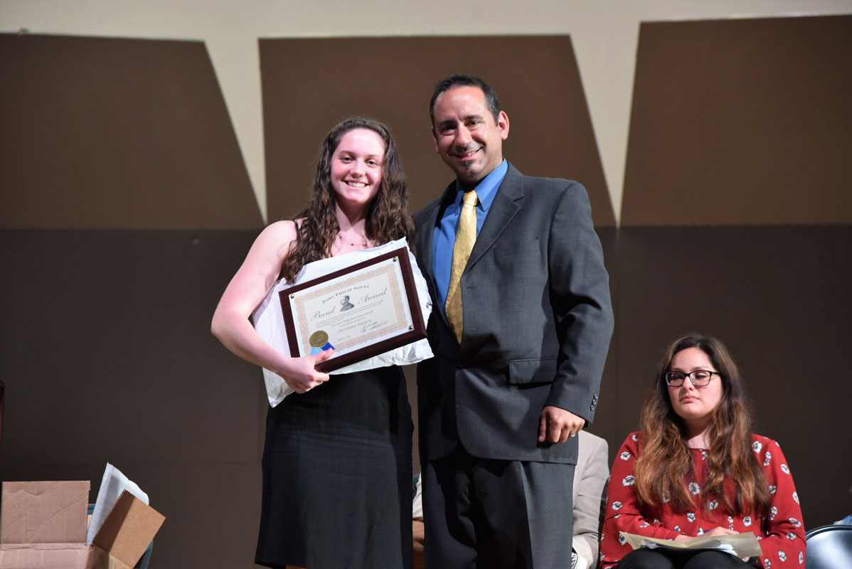 SUNY Brockport bound Christiana DeLuca was presented with the John Philip Sousa Award by teacher Jason Giachetti.