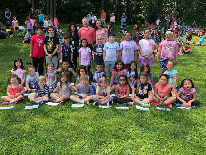 Southdown School Splash Award recipients lounging at the outdoor assembly 