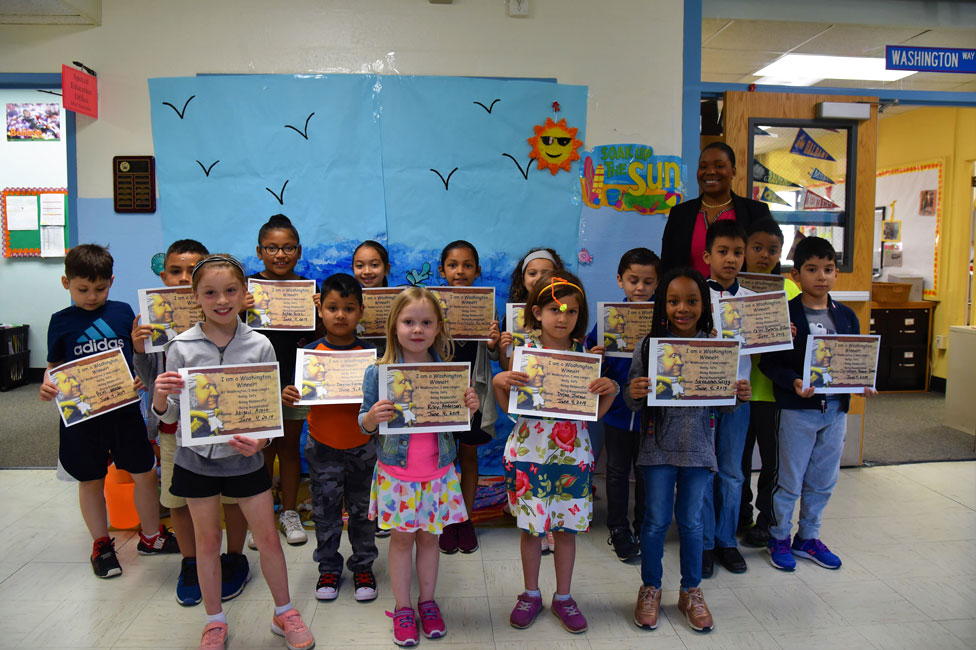 Principal Michelle Richards with May's Washington Ways Award recipients 