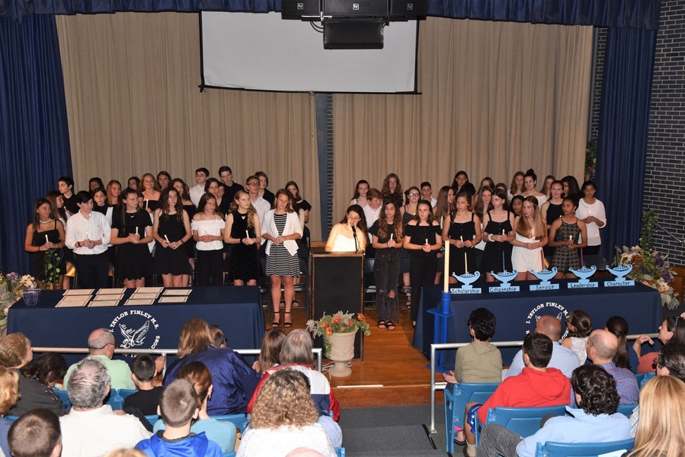 Finley's current honor society members filled the LGI stage and assisted during the induction ceremony.
