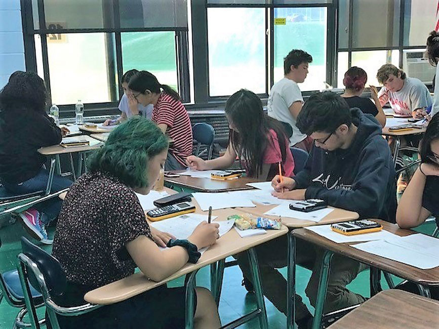 The Huntington High School Math Honor Society hosted Regents review night as 23 tutors worked with 60 students.