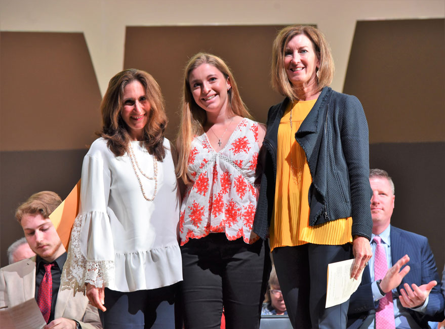 Huntington senior Cameron Fehrs is flanked by HFEE President Alice Marie Rorke and Chief Financial Officer Debbie Knowles