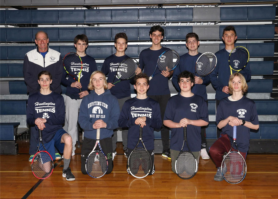 The Huntington junior varsity boys' tennis team with Blue Devil varsity coach Jamie Fishlow.