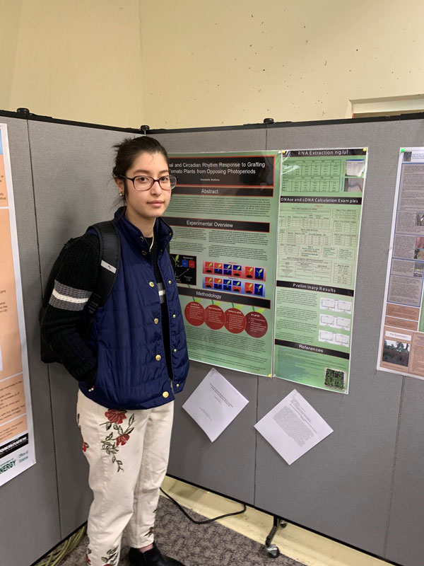 Annabella Matheus with her project at the LI Natural History Conference in Upton.