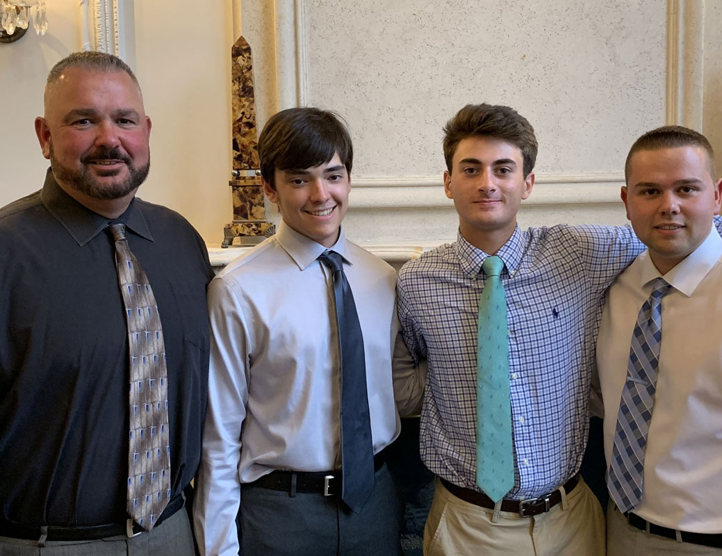 Coaches Billy Harris and Rob Cappas flank All-League players Kyle Colleluori and Chris Segreti.