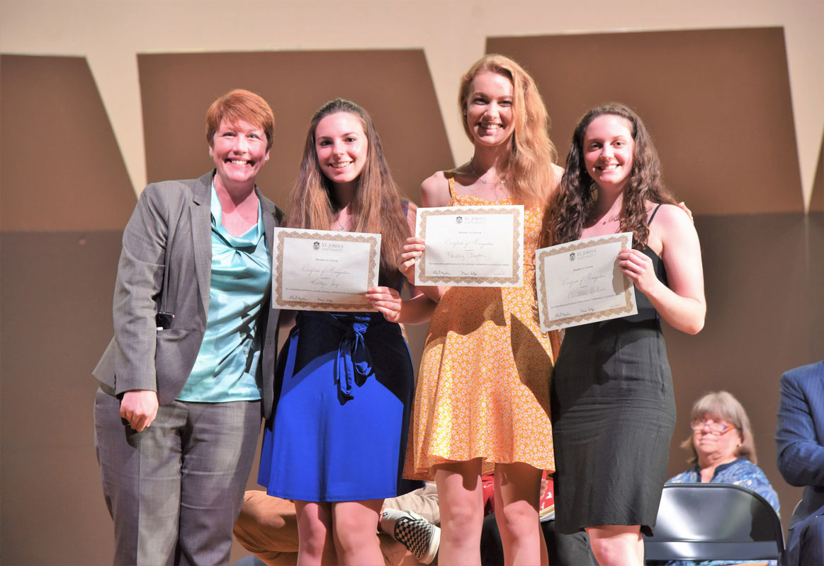 STEM Director Jill Johanson with St. John's Women in Science Award winners Kaitylyn Sage, Hadley Clayton and Christiana DeLuca.