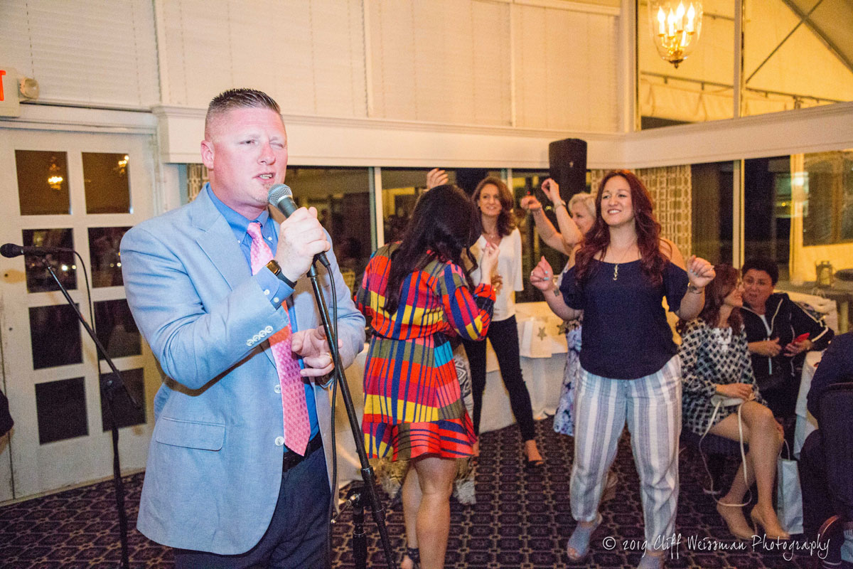 Huntington High School Principal Brenden Cusack sang with the band at the gala. (Cliff Weissman photo)
