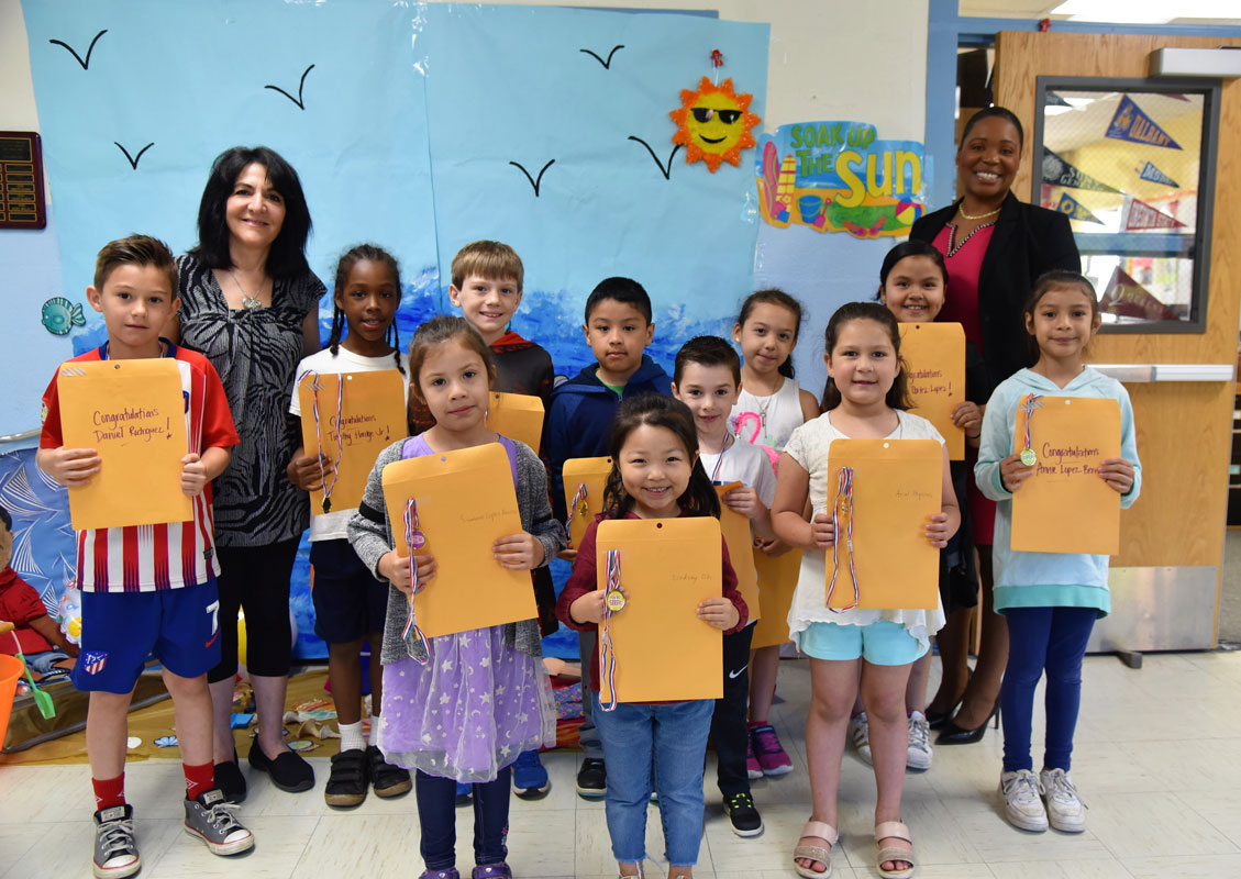 Washington's Featured Artists for June with teacher Maria Mazzola and Principal Michelle Richards.
