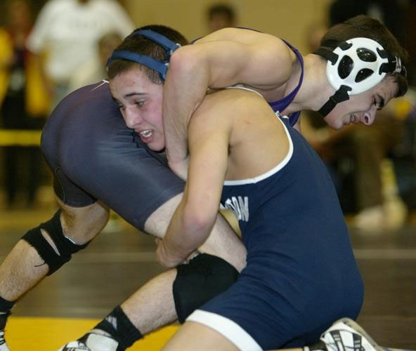 Justin Giani (right) on the mat for Huntington High School.