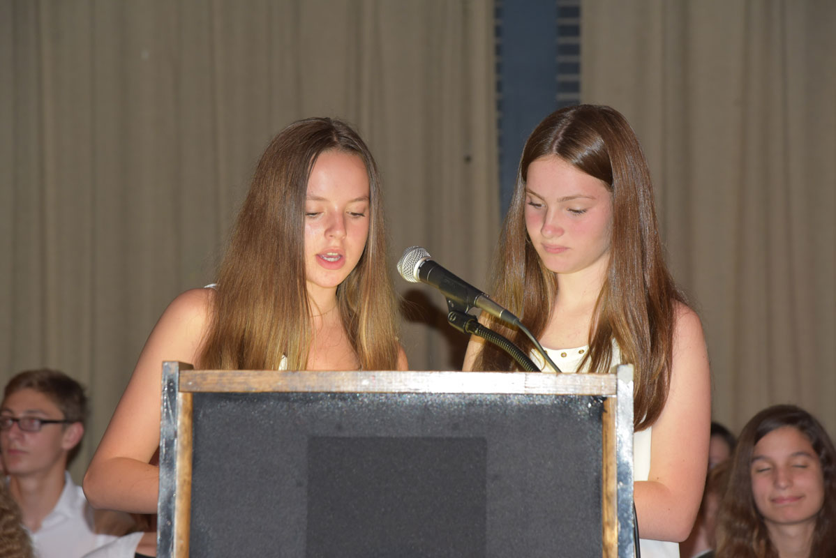 Current eighth grade honor society members assisted throughout the induction ceremony.