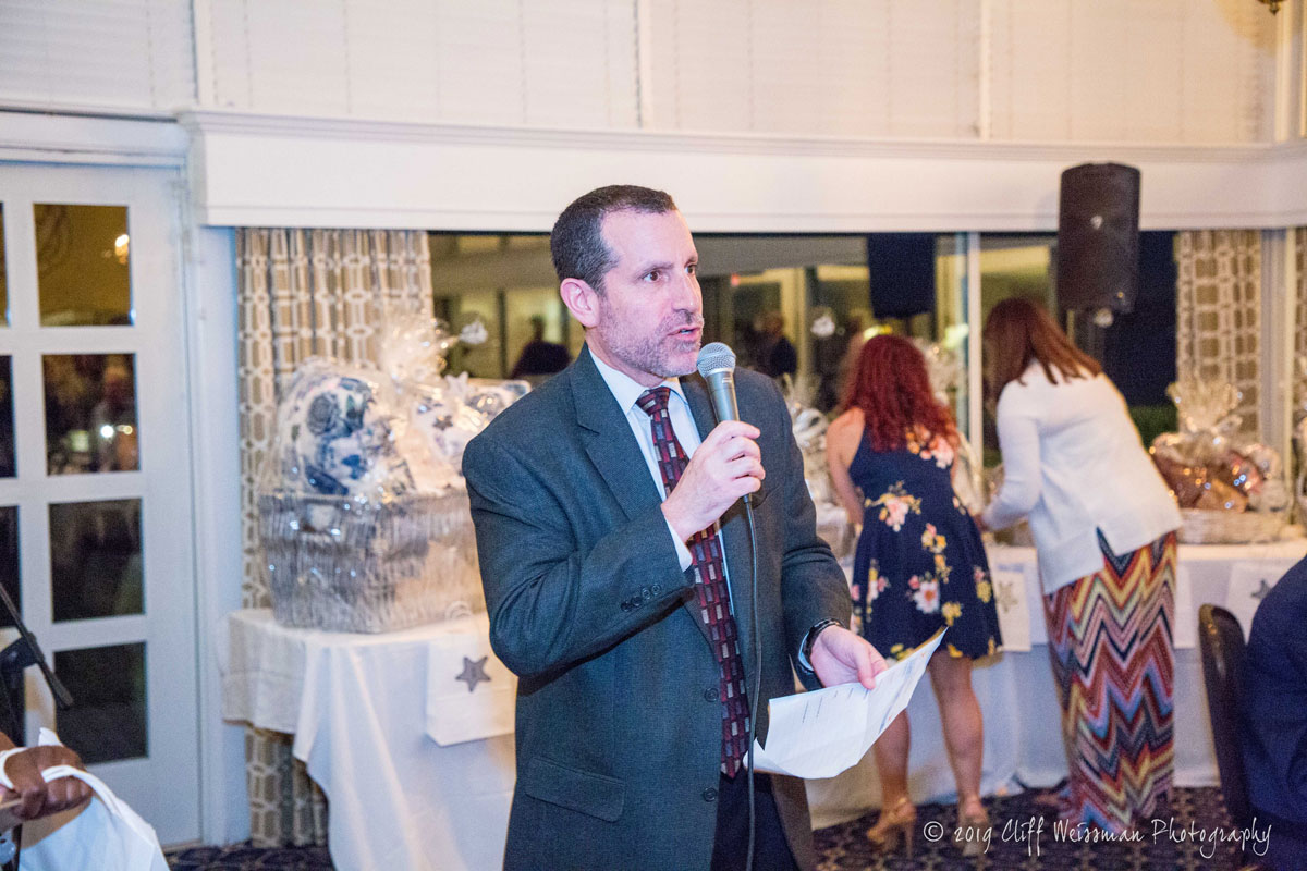 Superintendent Jim Polansky used his auctioneer skills to raise more than $900. (Cliff Weissman photo.)