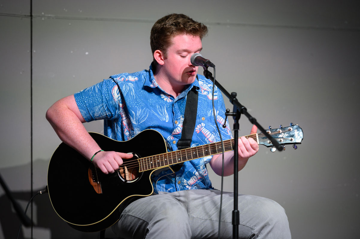 Teddy Holly performed Bob Dylan's Don't Think Twice, It's All Right on guitar. (Darin Reed photo.)