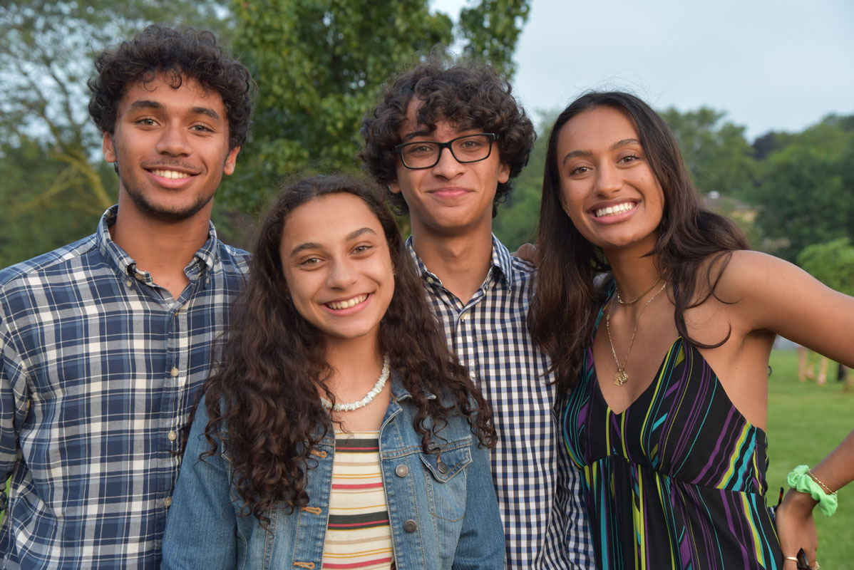 Samuel James (second from right) with his brother and sisters following the moving-up ceremony.