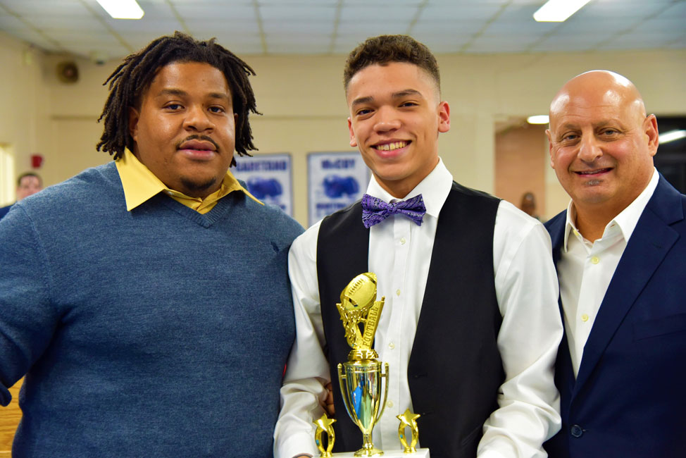 Al White Service Award recipient Lex Colato with Andrew White and Steve Muller.