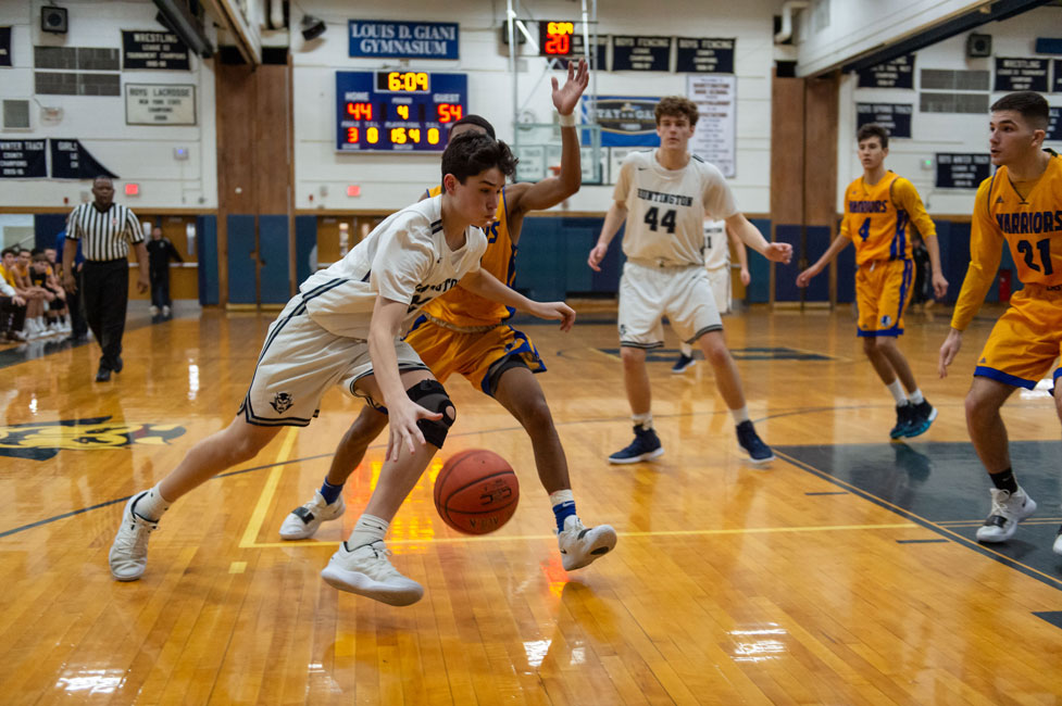 Junior Dan Danziger dribbles around the defense. (Darin Reed photo