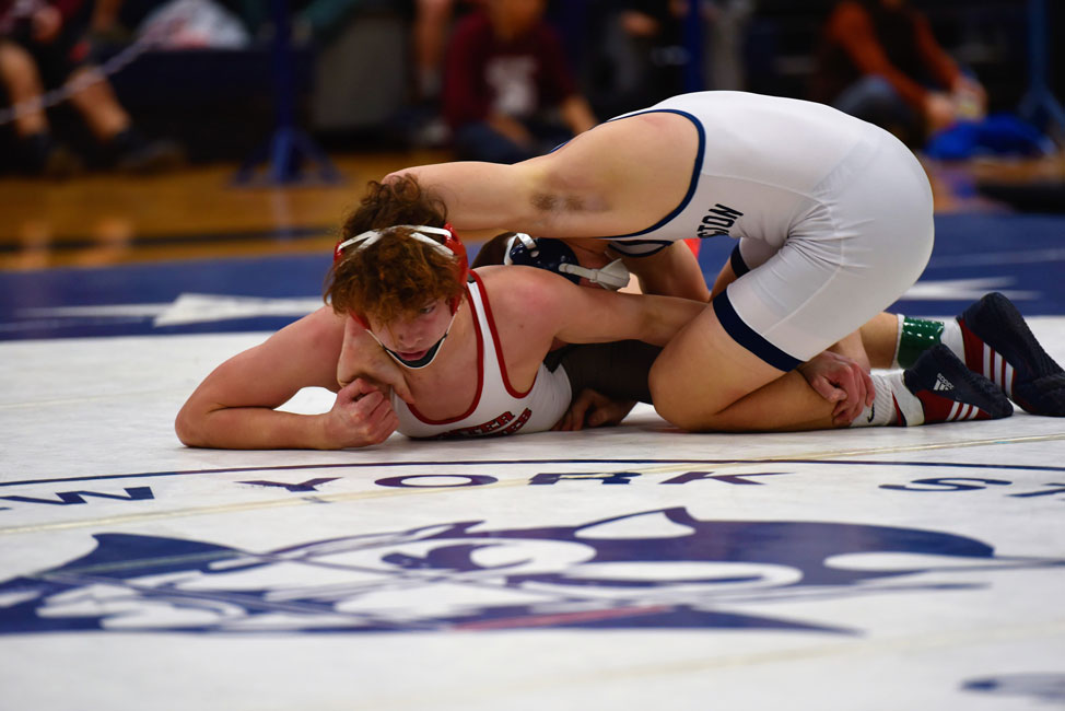 Huntington junior Aedan McDonald (right) smothers his opponent.