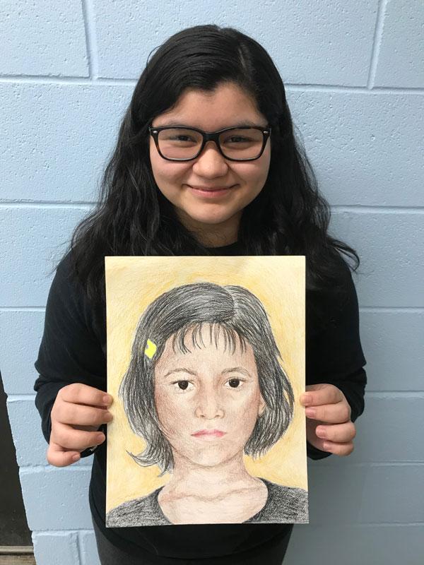 Huntington High School Art Honor Society members created portraits for the Memory Project.