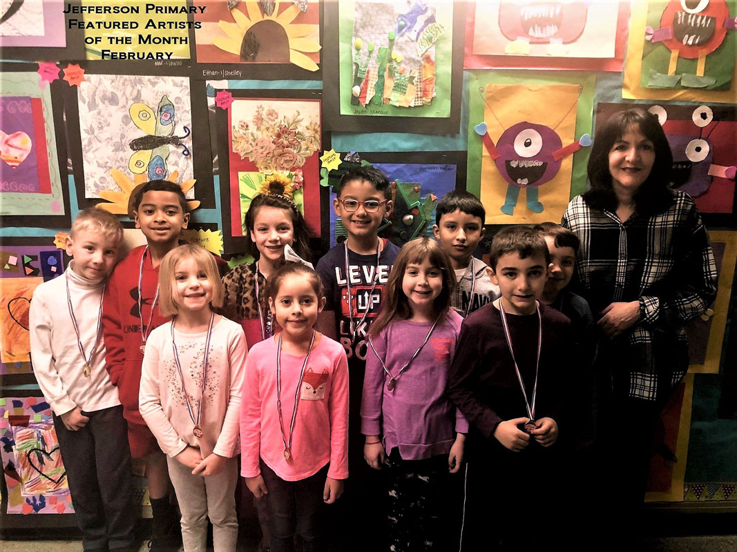 Art teacher Maria Mazzola with Jefferson's February's Featured Artists of the Month.