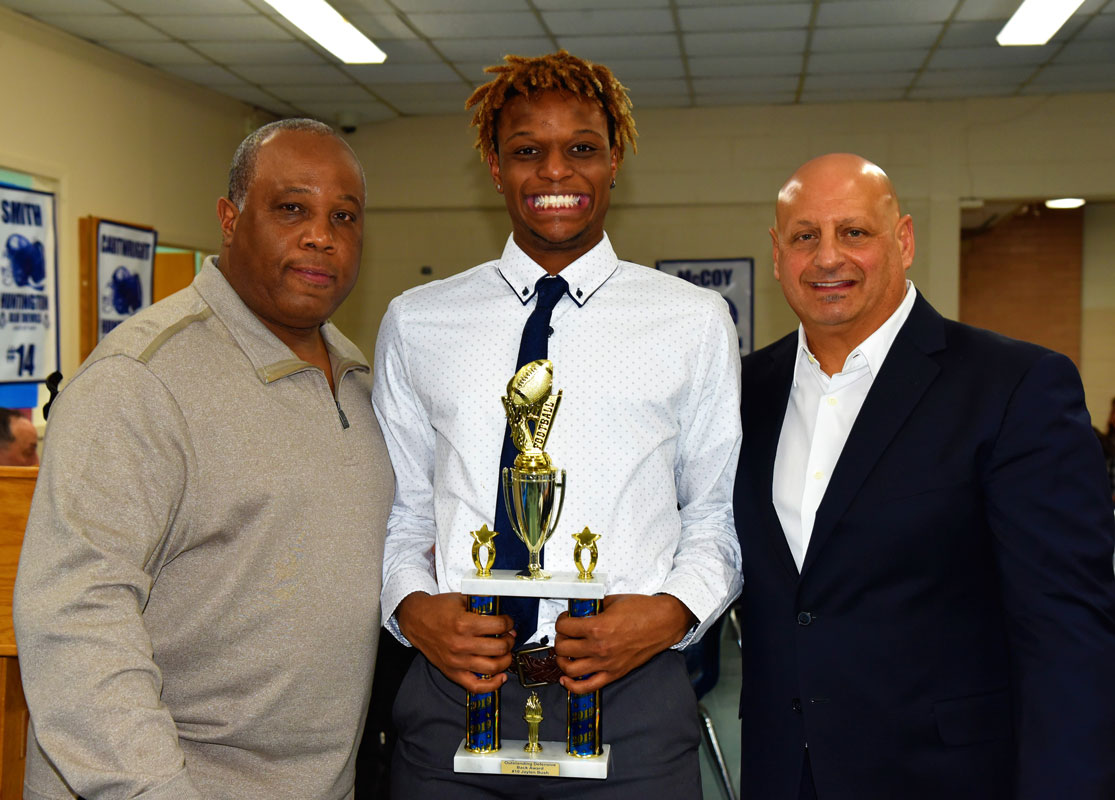 Outstanding Defensive Back Award winner Jaylen Bush with coaches Todd Jamison and Steve Muller 