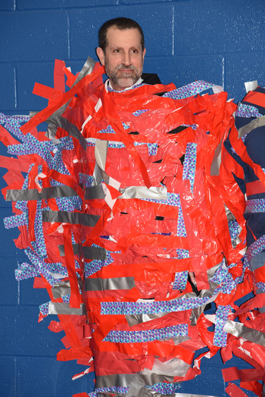 Huntington Superintendent Jim Polansky was a good sport, allowing himself to be duct taped to the Finley gym wall